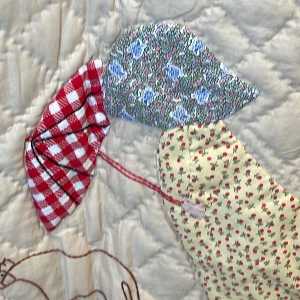 Appliqued and embroidered quilt
